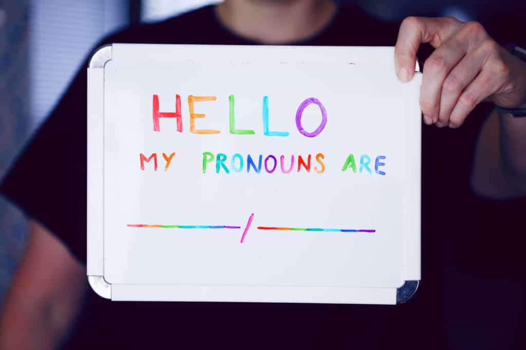 colorfull text "hello my pronouns are" on paper
